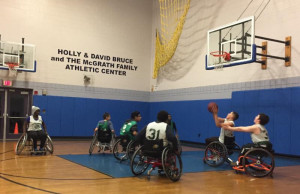 Group of Boys and Girls Club playing wheelchair basketball